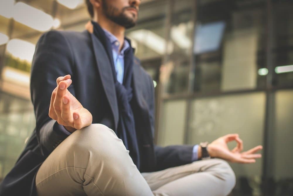 an employee meditating at work