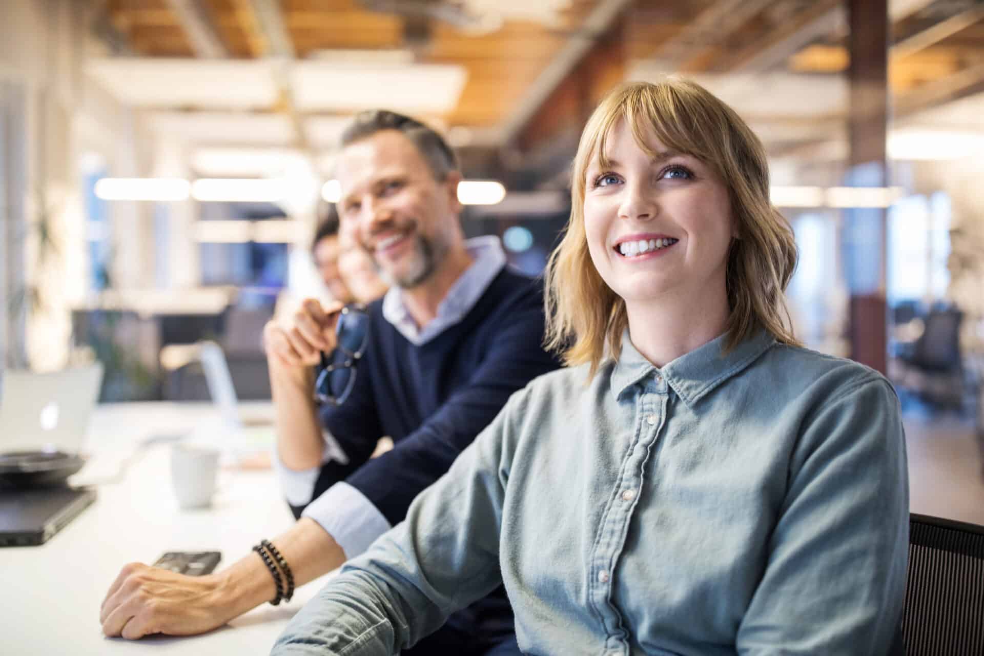 Happy business people in a meeting about learning and development.