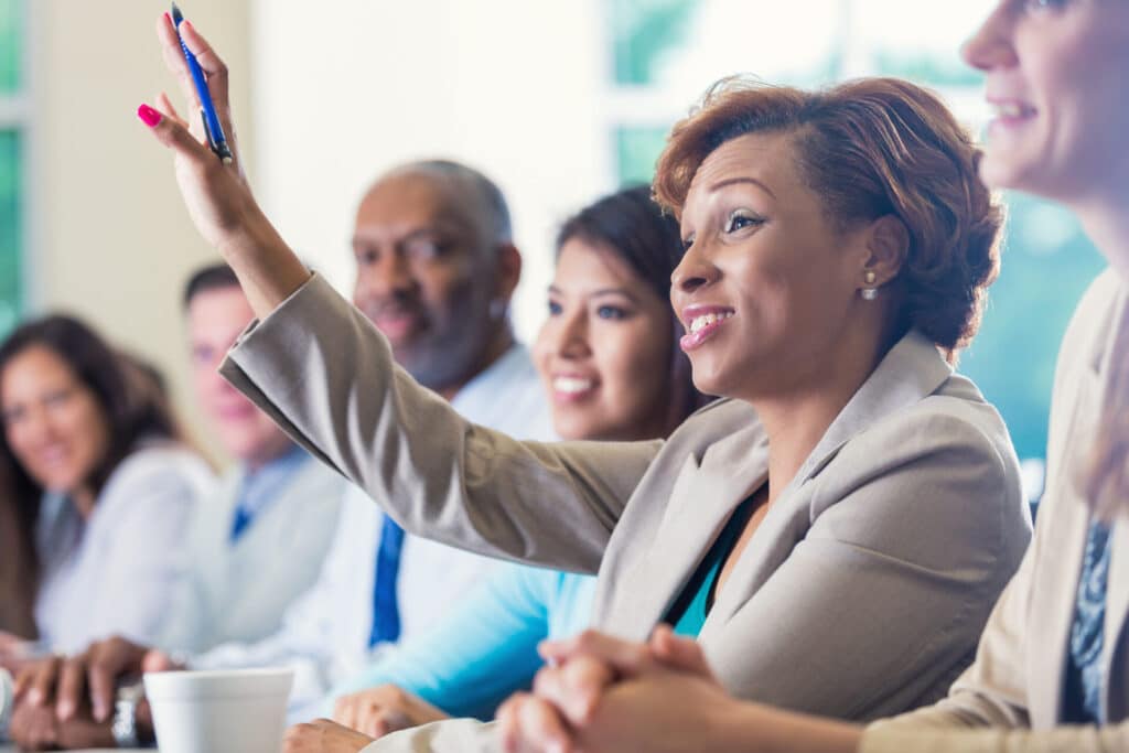 Happy employees who are learning in a course.