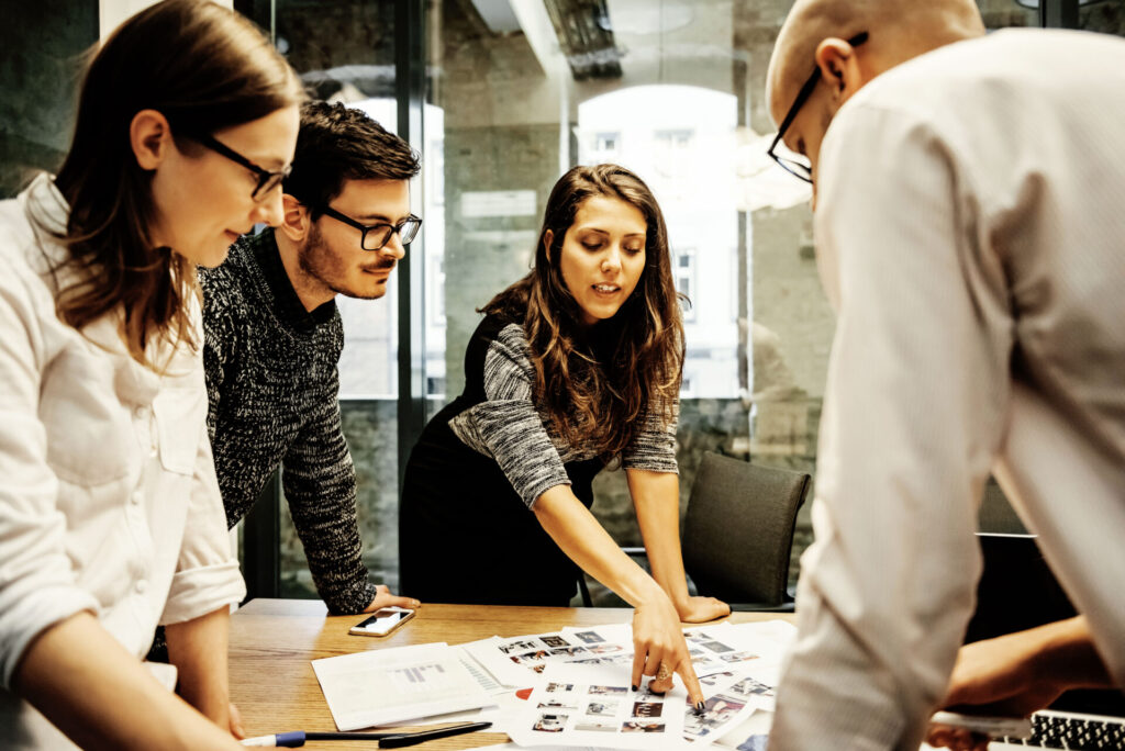 A team of young business people in a modern office is discussing important hr topics.