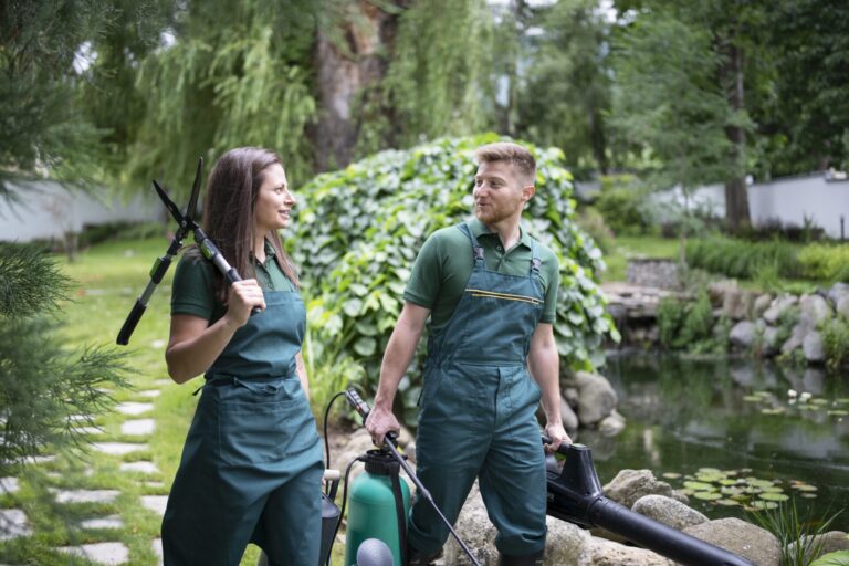 Professional Landscaping Team Working In Garden