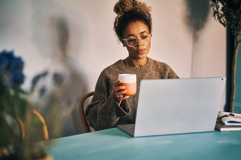 woman with coffee learning Spanish for business