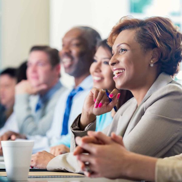 Happy employees who are learning in a course.